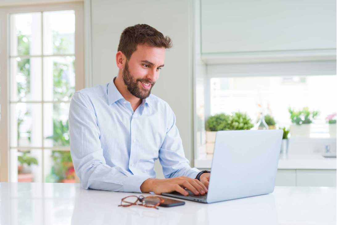 A man on the computer looking up personal loans in Wisconsin
